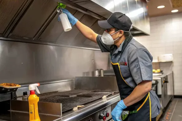 maintenance-worker-cleans-large-kitchen-hood-generative-ai-reqz3wgmcvkbgw21ca8j2hqp2xi82gb6w45ti62z6i